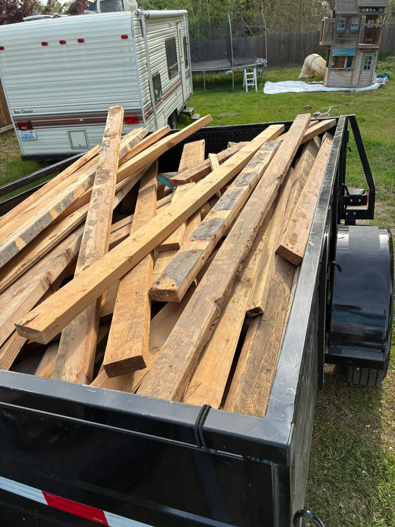 Trailer loaded with lumber and construction debris
